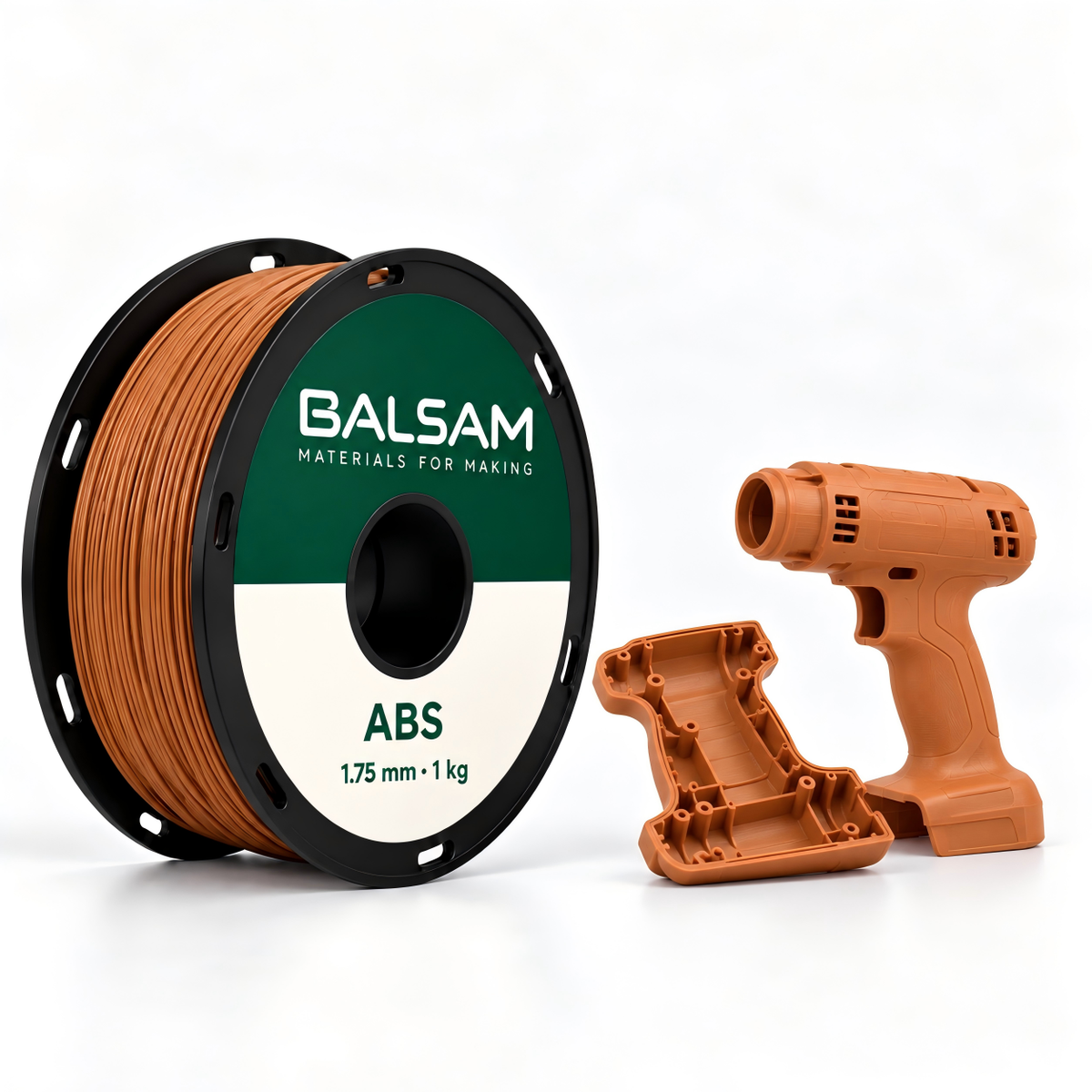 BALSAM ABS warm orange filament spool, 1.75 mm, 1 kg, beside matching 3D-printed power tool housing prototypes.
